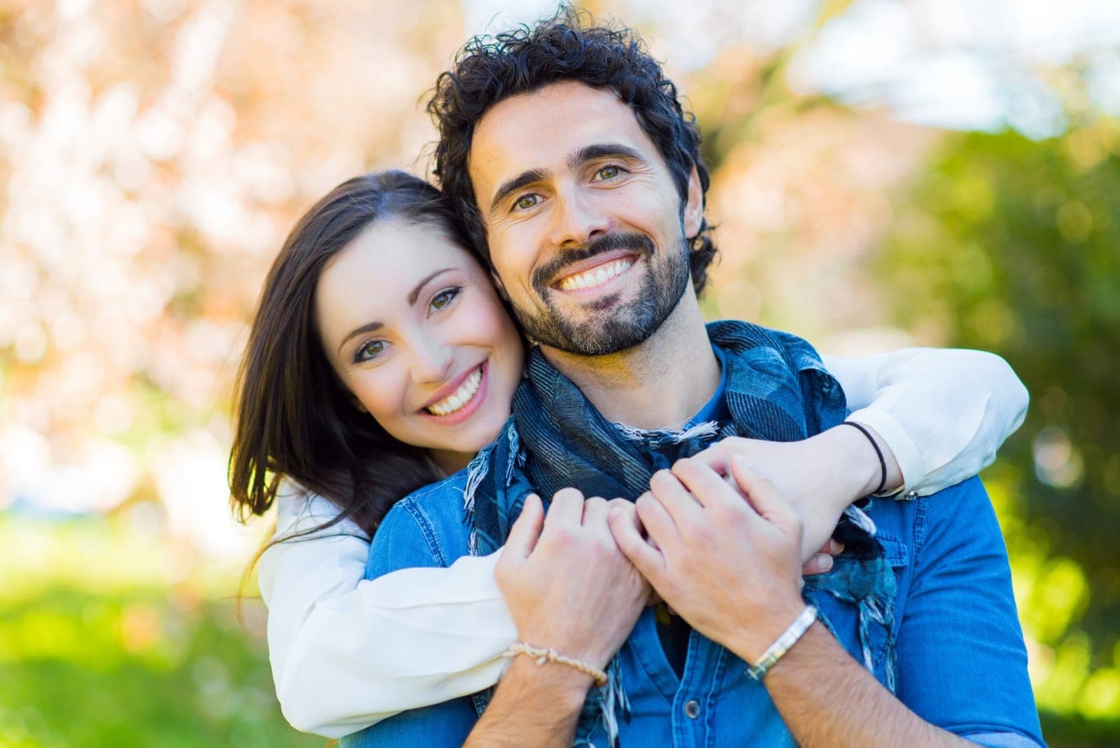 Happy couple with beautiful smiles at Sherwood Park Dental
